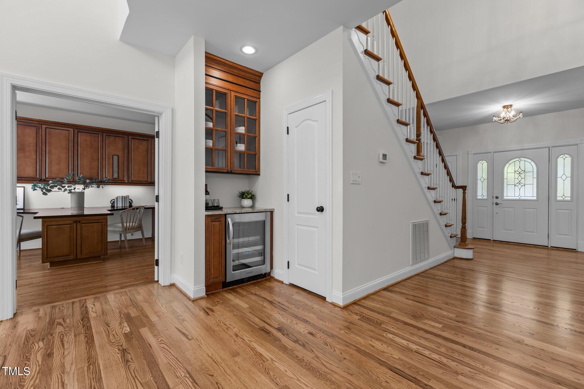 103 Ticonderoga Road Cary, NC 27519 - Photo 24 of 65 a view of a kitchen with a sink cabinet and a living room