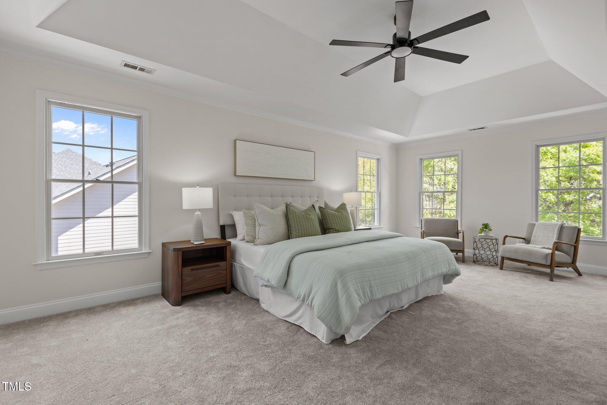 103 Ticonderoga Road Cary, NC 27519 - Photo 27 of 65 a spacious bedroom with a bed and furniture