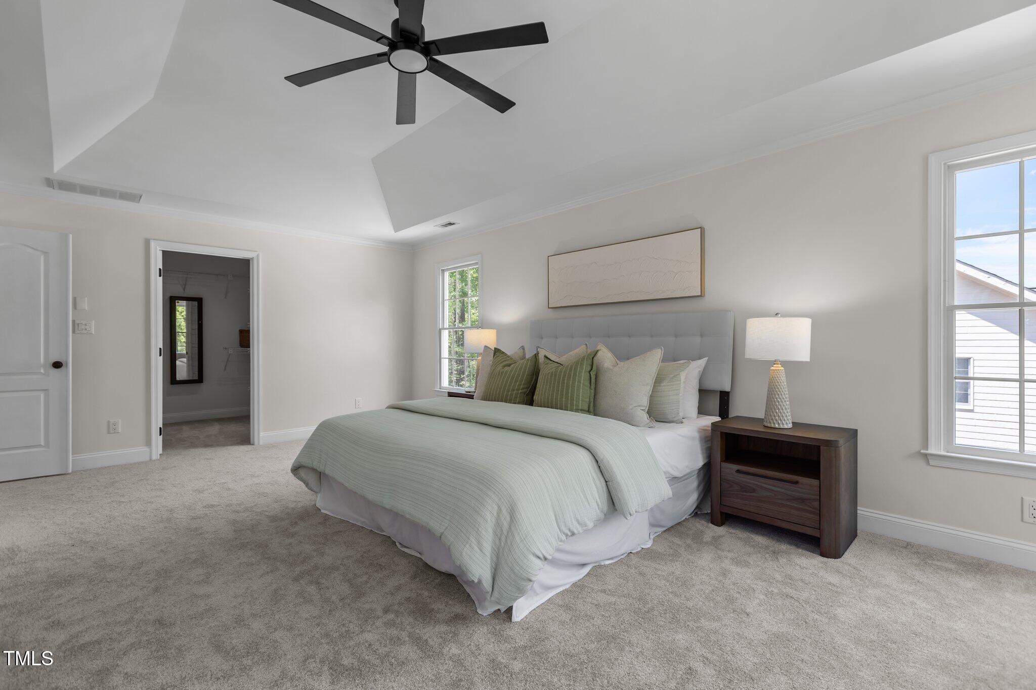 103 Ticonderoga Road Cary, NC 27519 - Photo 29 of 65 a spacious bedroom with a bed and a window