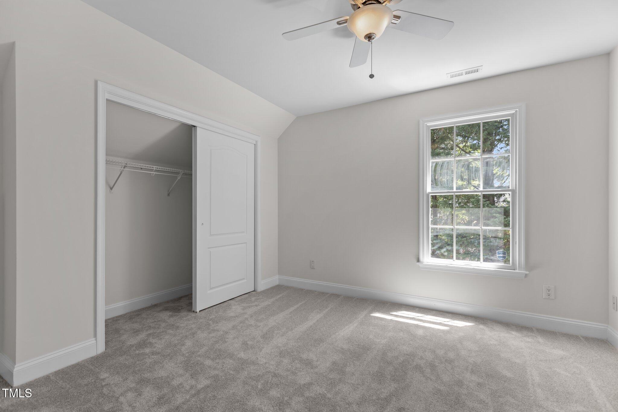 103 Ticonderoga Road Cary, NC 27519 - Photo 39 of 65 an empty room with a window and a fan
