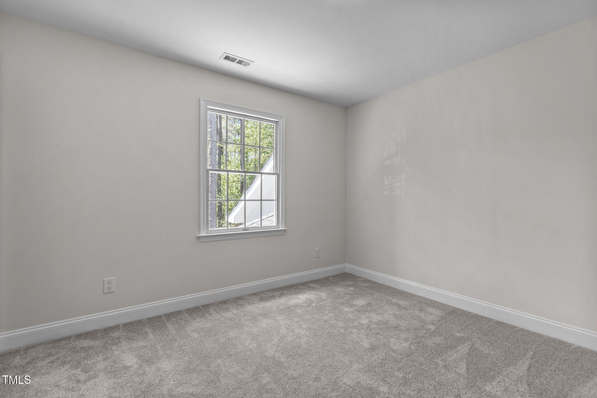 103 Ticonderoga Road Cary, NC 27519 - Photo 42 of 65 an empty room with a window