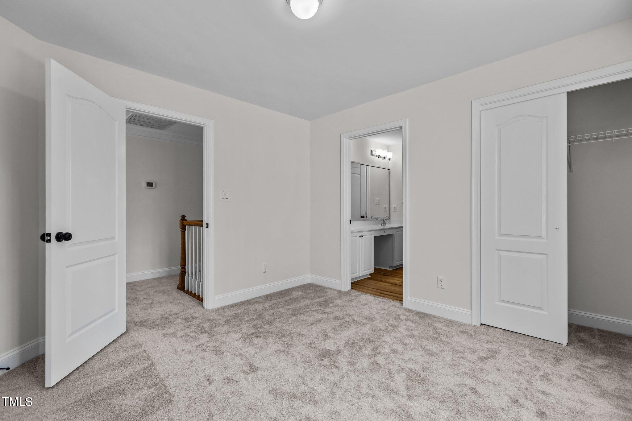 103 Ticonderoga Road Cary, NC 27519 - Photo 43 of 65 an empty room with closet and a hallway