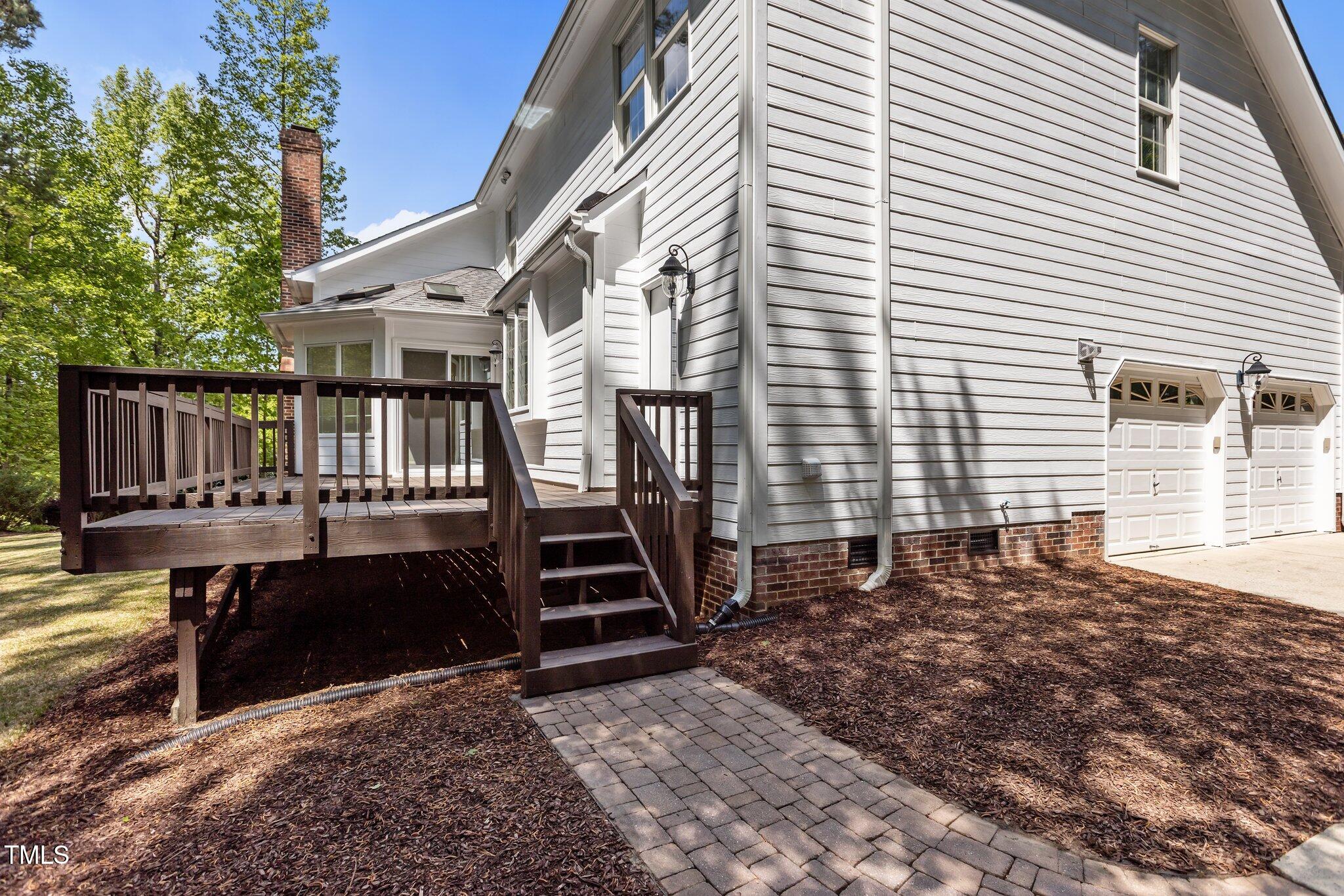 103 Ticonderoga Road Cary, NC 27519 - Photo 46 of 65 a view of a house with backyard porch and sitting area