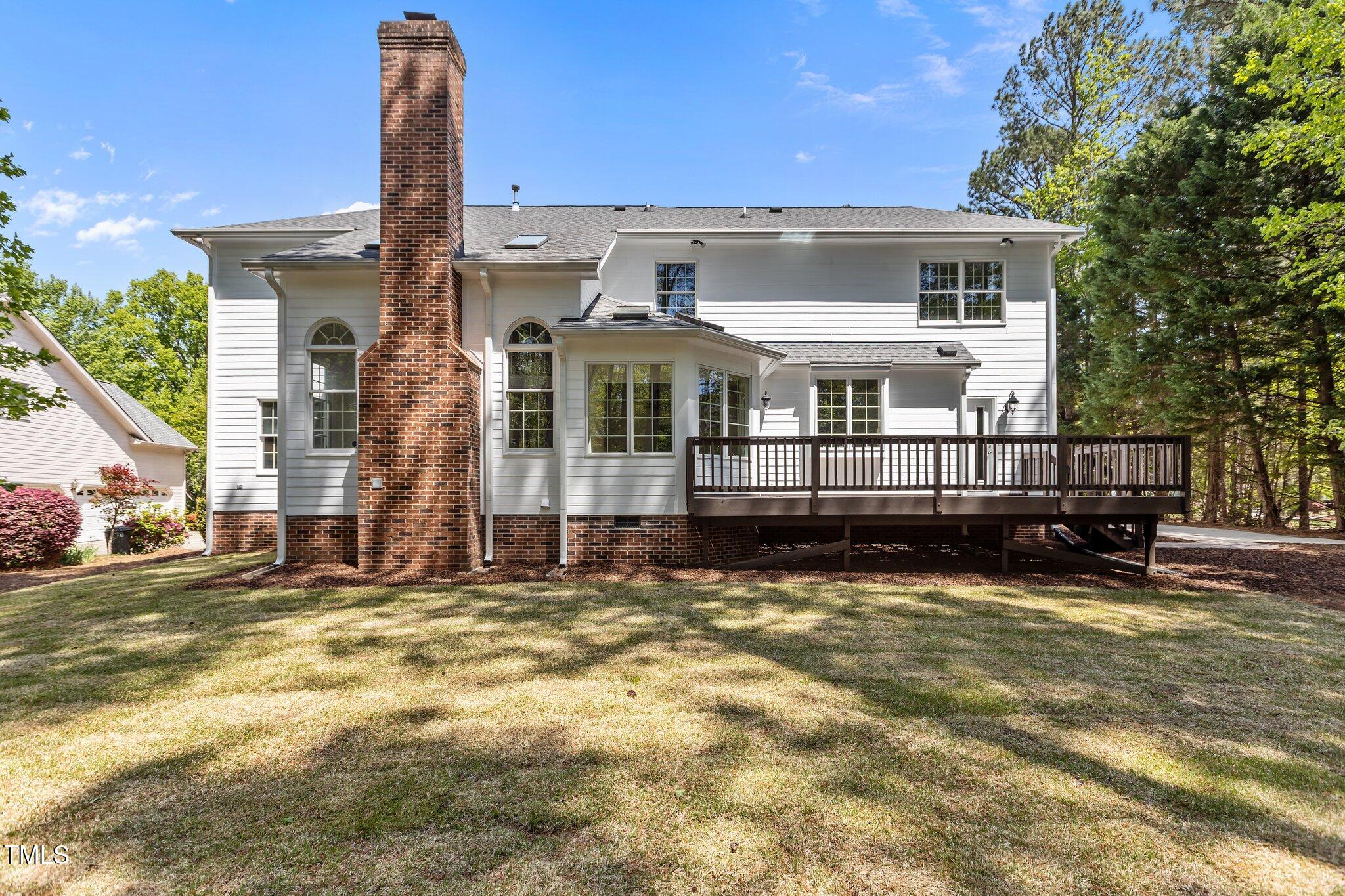 103 Ticonderoga Road Cary, NC 27519 - Photo 48 of 65 a view of a house with a wooden fence
