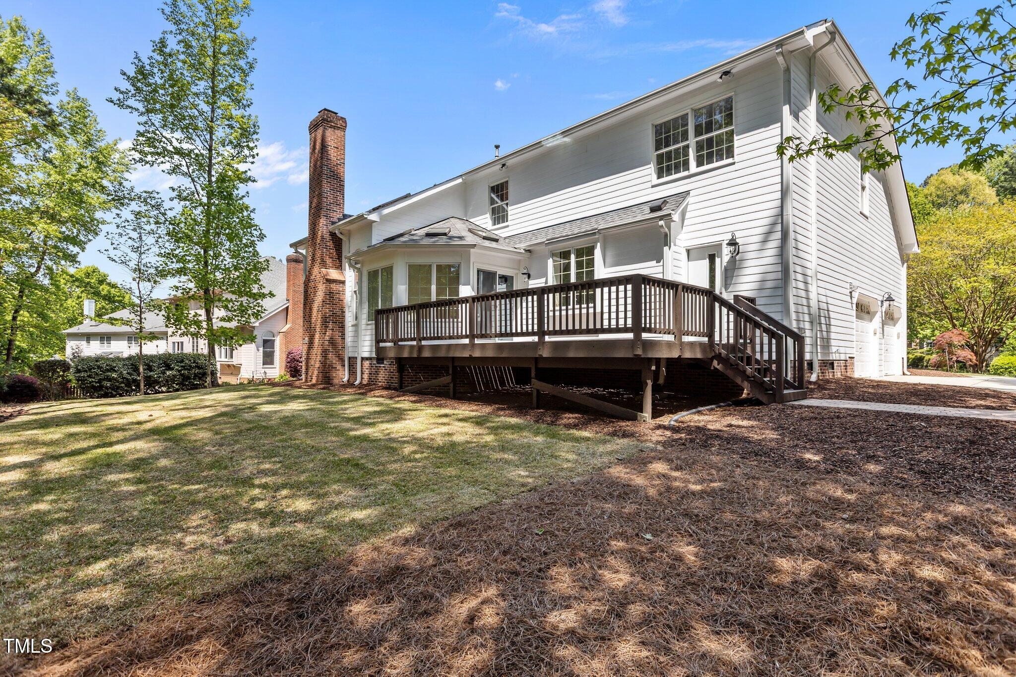 103 Ticonderoga Road Cary, NC 27519 - Photo 49 of 65 a view of a house with a yard