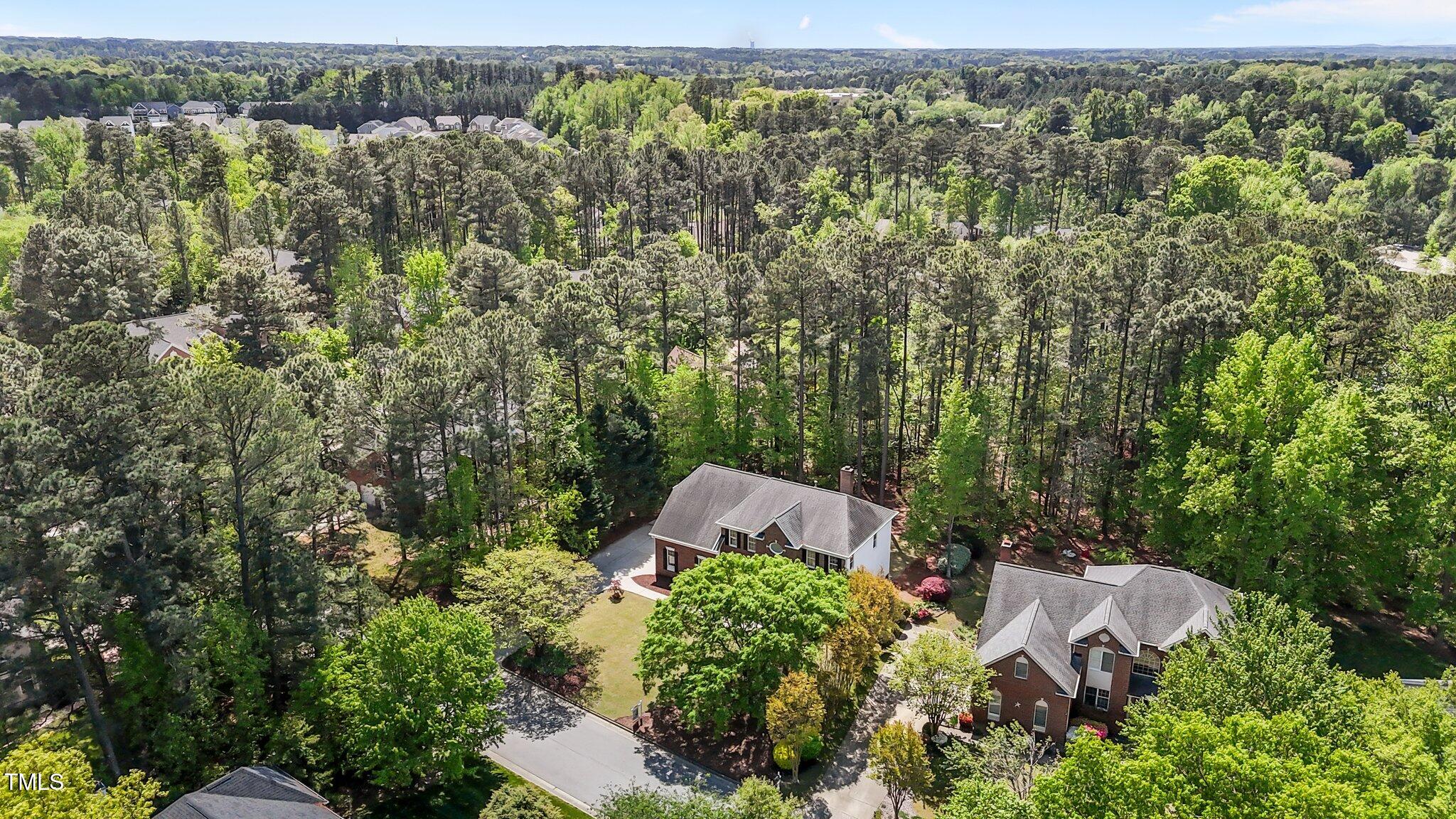 103 Ticonderoga Road Cary, NC 27519 - Photo 57 of 65 an aerial view of a house with yard and outdoor seating