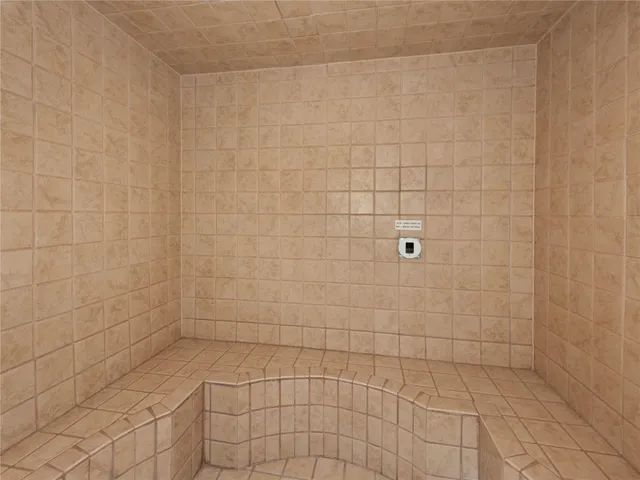 a balcony with wooden floor and city view