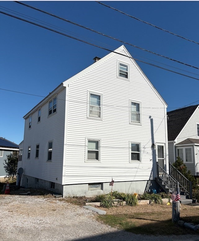 10 16th Street, Unit 1 Newbury, MA 01951 - Photo 1 of 5 a front view of a house with street