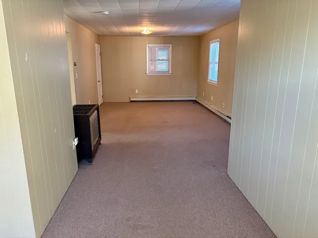 a bathroom with a sink a toilet and a window