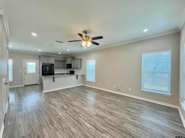 a view of kitchen with cabinets and wooden floor