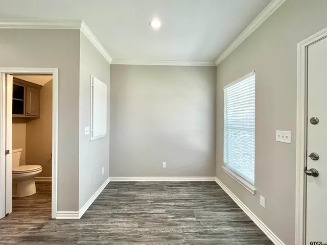 a view of a bathroom from a hallway