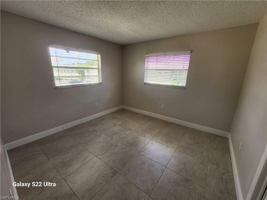 3325 Airport Road North, Unit N8 Naples, FL 34105 - Photo 13 of 22 an empty room with windows