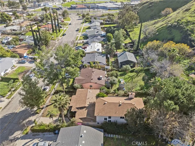 an aerial view of residential houses with outdoor space