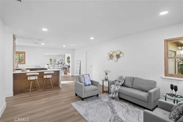 a living room with furniture and a table