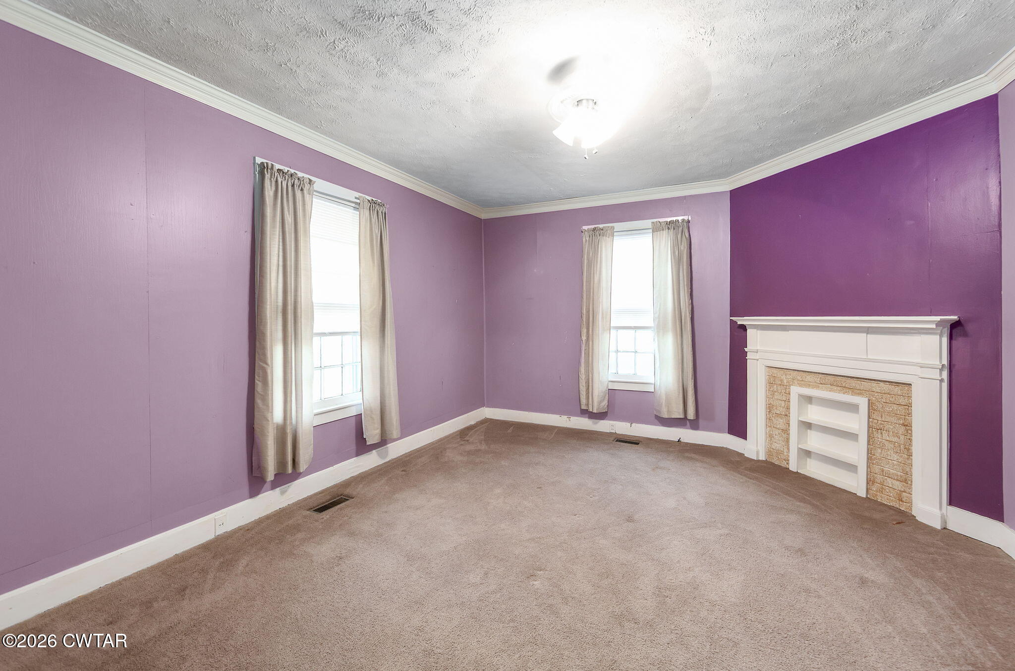 4 Farwell Street Jackson, TN 38301 - Photo 17 of 25 an empty room with windows and fireplace