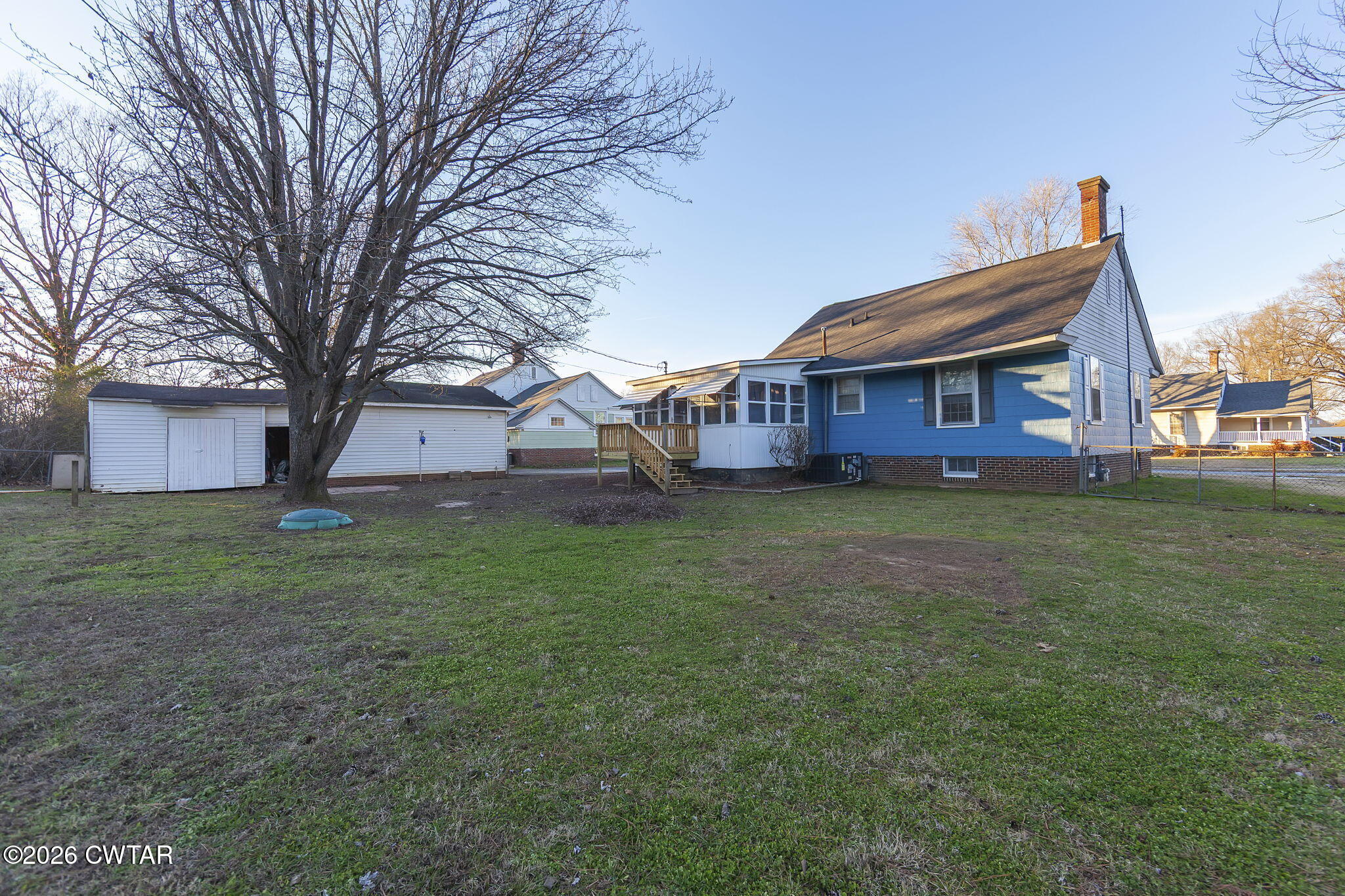 4 Farwell Street Jackson, TN 38301 - Photo 22 of 25 a view of a house with a big yard and large trees