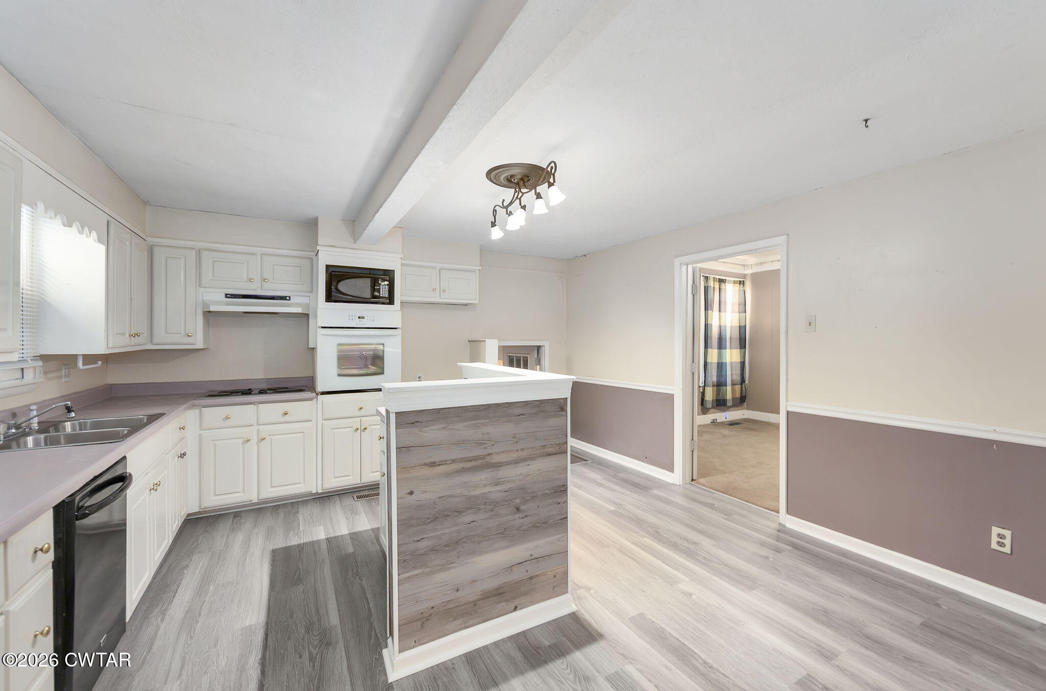 4 Farwell Street Jackson, TN 38301 - Photo 4 of 25 a kitchen with granite countertop a sink cabinets stainless steel appliances and a window