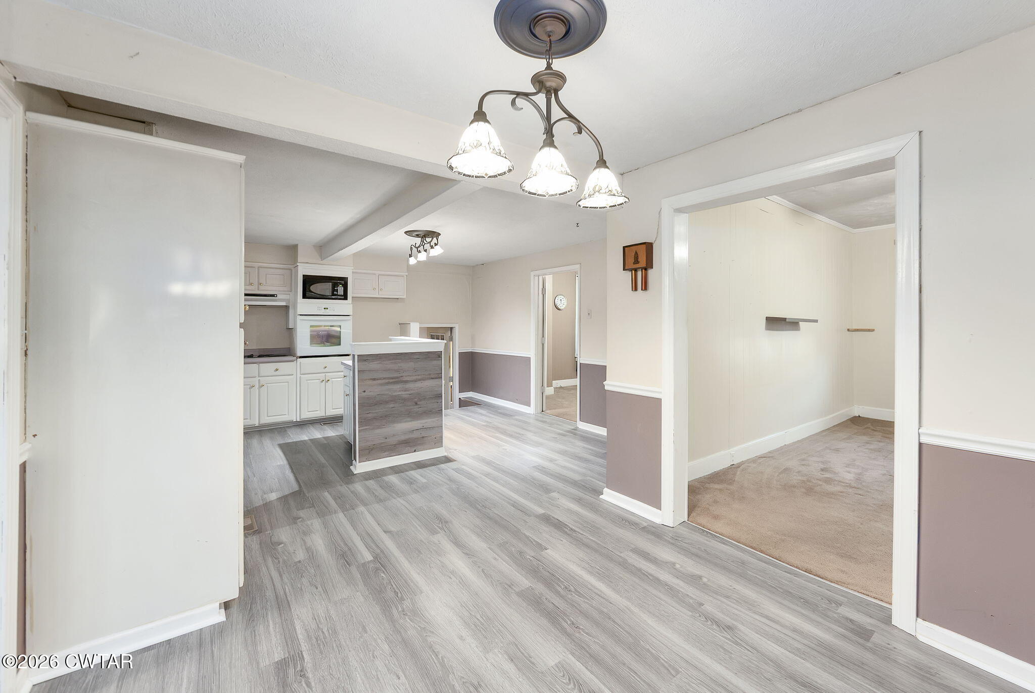 4 Farwell Street Jackson, TN 38301 - Photo 6 of 25 a view of a kitchen with a sink a refrigerator and wooden floor