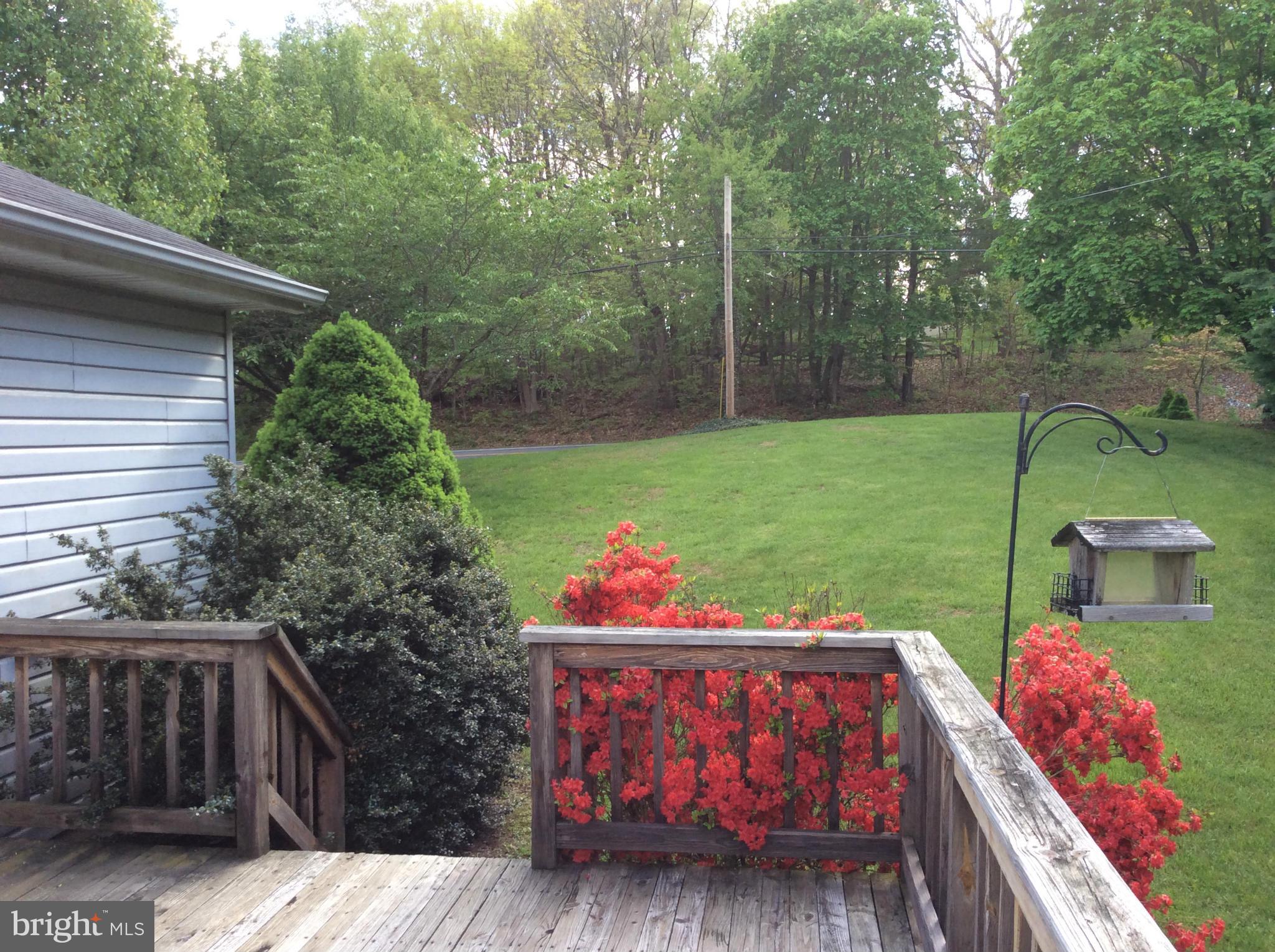 2601 Old Washington Road Westminster, MD 21157 - Photo 25 of 27 a view of a chairs and table in the backyard