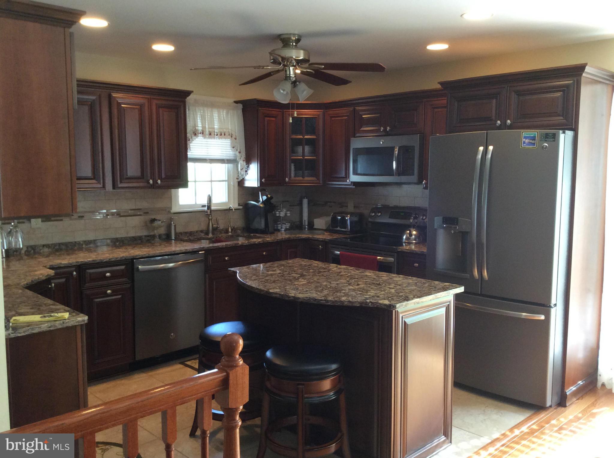 2601 Old Washington Road Westminster, MD 21157 - Photo 5 of 27 a kitchen with stainless steel appliances granite countertop a sink stove and refrigerator