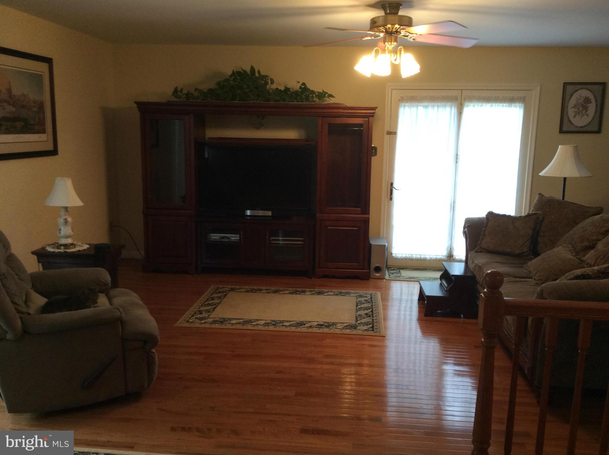 2601 Old Washington Road Westminster, MD 21157 - Photo 7 of 27 a living room with furniture and a fireplace