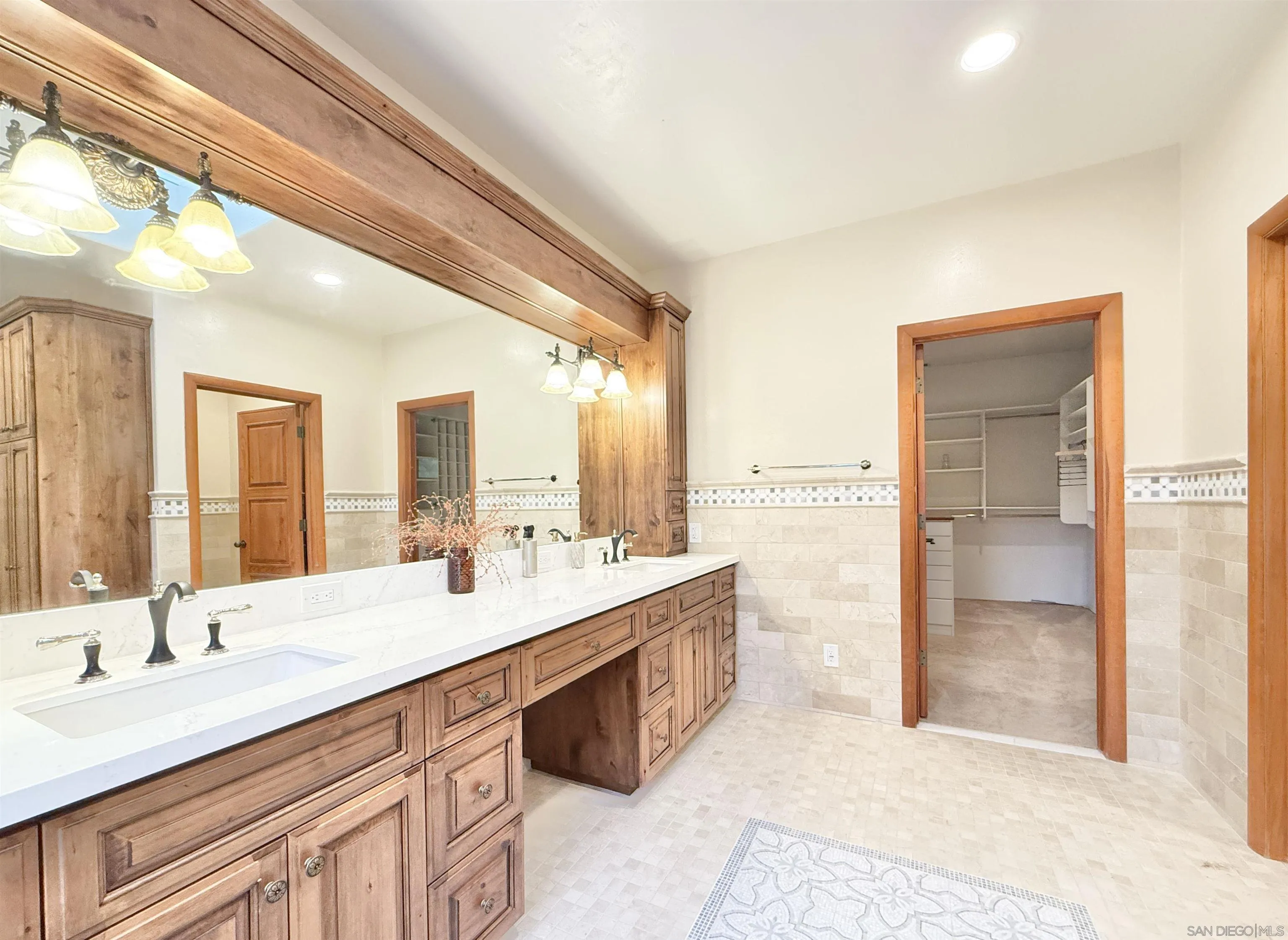 16722 Via Lago Azul Rancho Santa Fe, CA 92067 - Photo 15 of 28 a bathroom with a sink double vanity and a mirror
