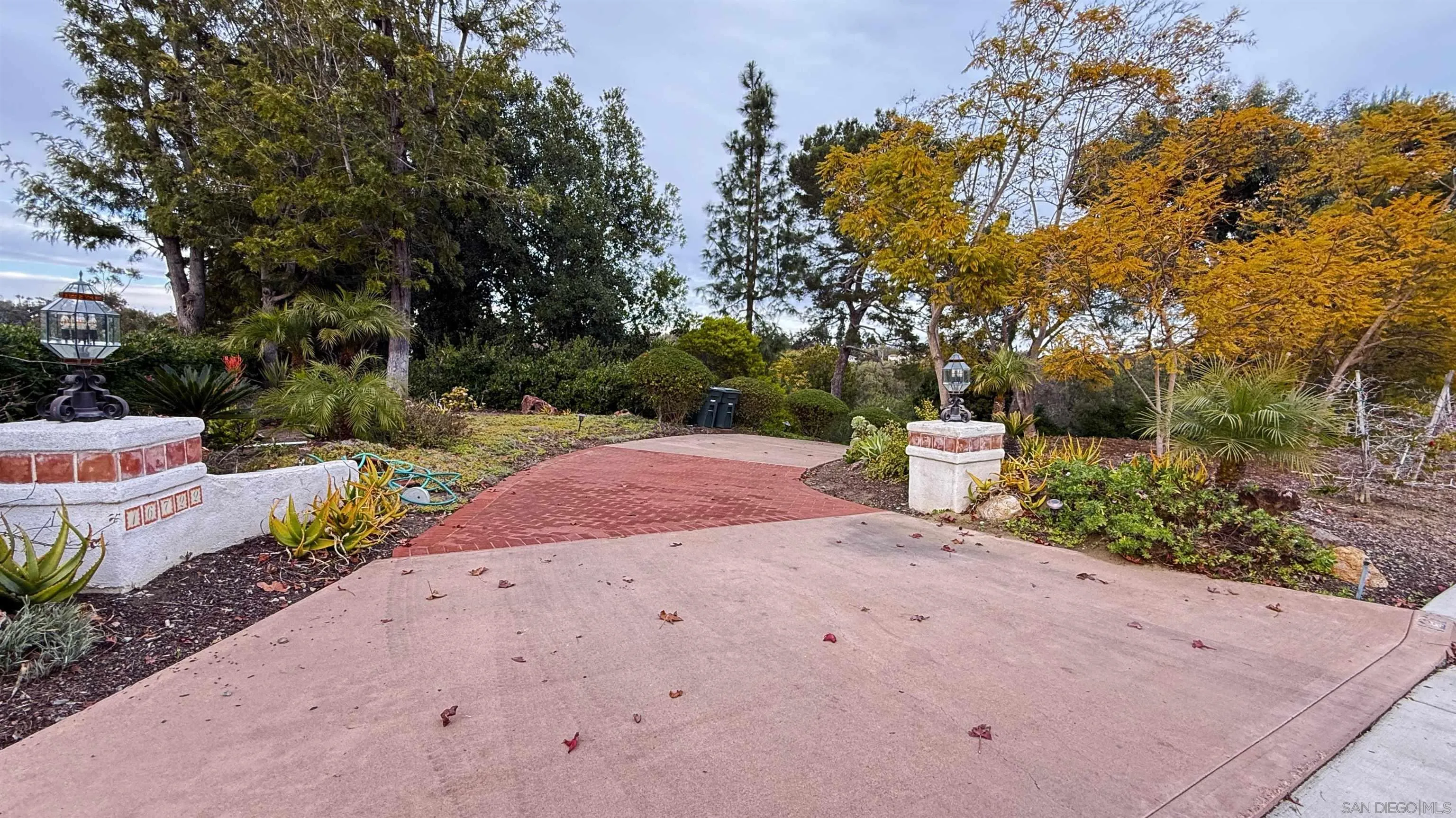 16722 Via Lago Azul Rancho Santa Fe, CA 92067 - Photo 28 of 28 a white house with a yard and lake view