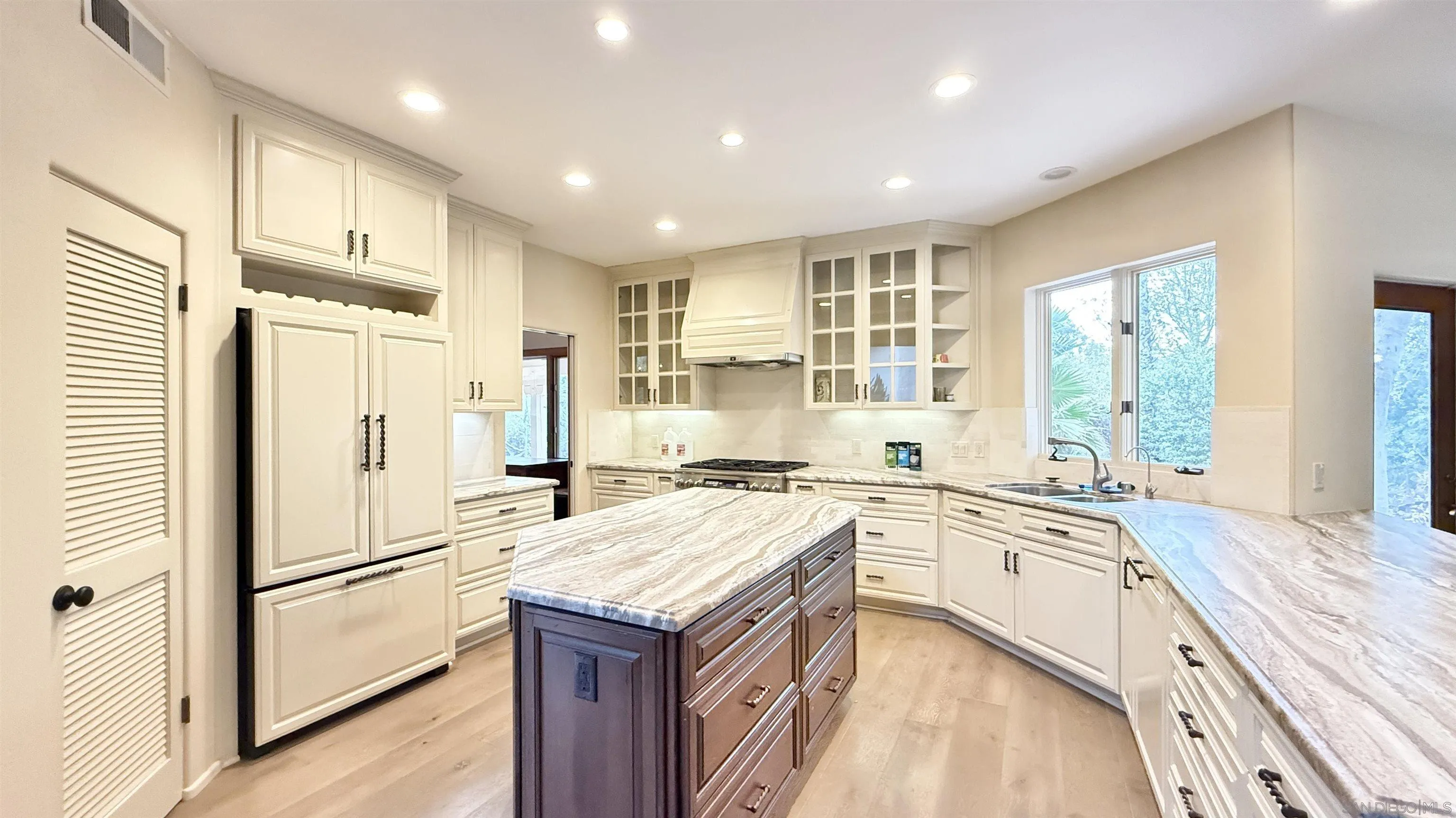 16722 Via Lago Azul Rancho Santa Fe, CA 92067 - Photo 7 of 28 a kitchen with a sink a stove a refrigerator and a refrigerator