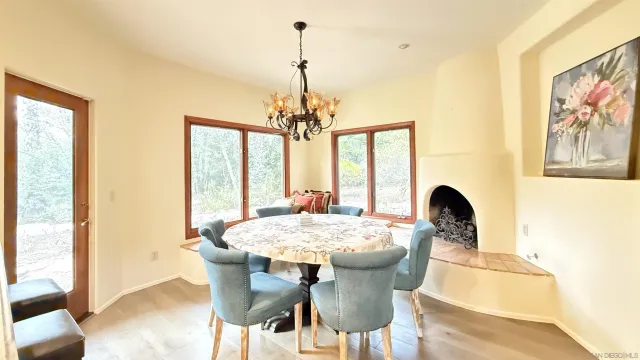 a dining room with furniture and window