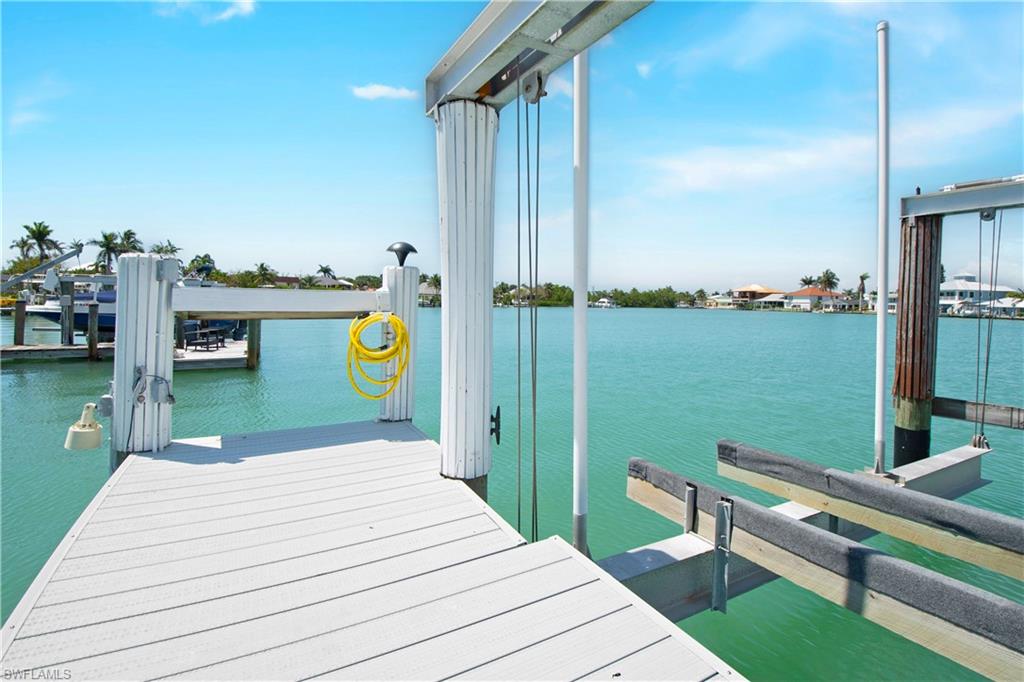 19 East Pelican Street Naples, FL 34113 - Photo 39 of 50 a view of a terrace with chairs