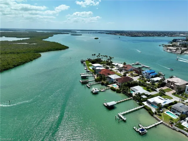 an aerial view of ocean residential houses with outdoor space and lake view