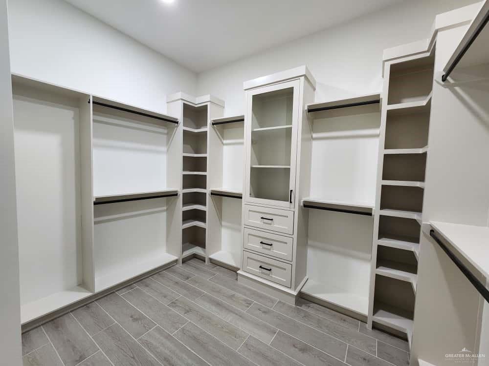 1003 Azalea Street Mission, TX 78573 - Photo 11 of 17 a view of walk in closet with empty racks