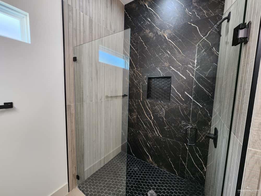 1003 Azalea Street Mission, TX 78573 - Photo 12 of 17 a bathroom with a shower