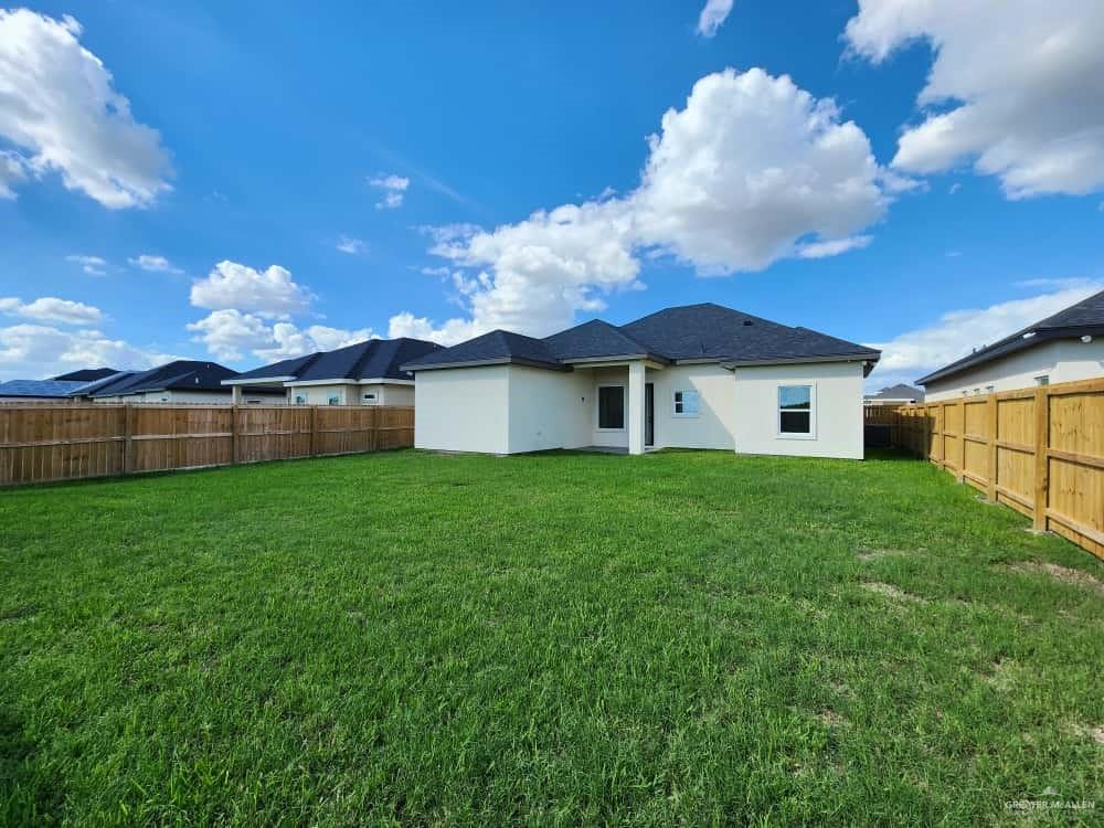 1003 Azalea Street Mission, TX 78573 - Photo 16 of 17 a view of a yard with a house