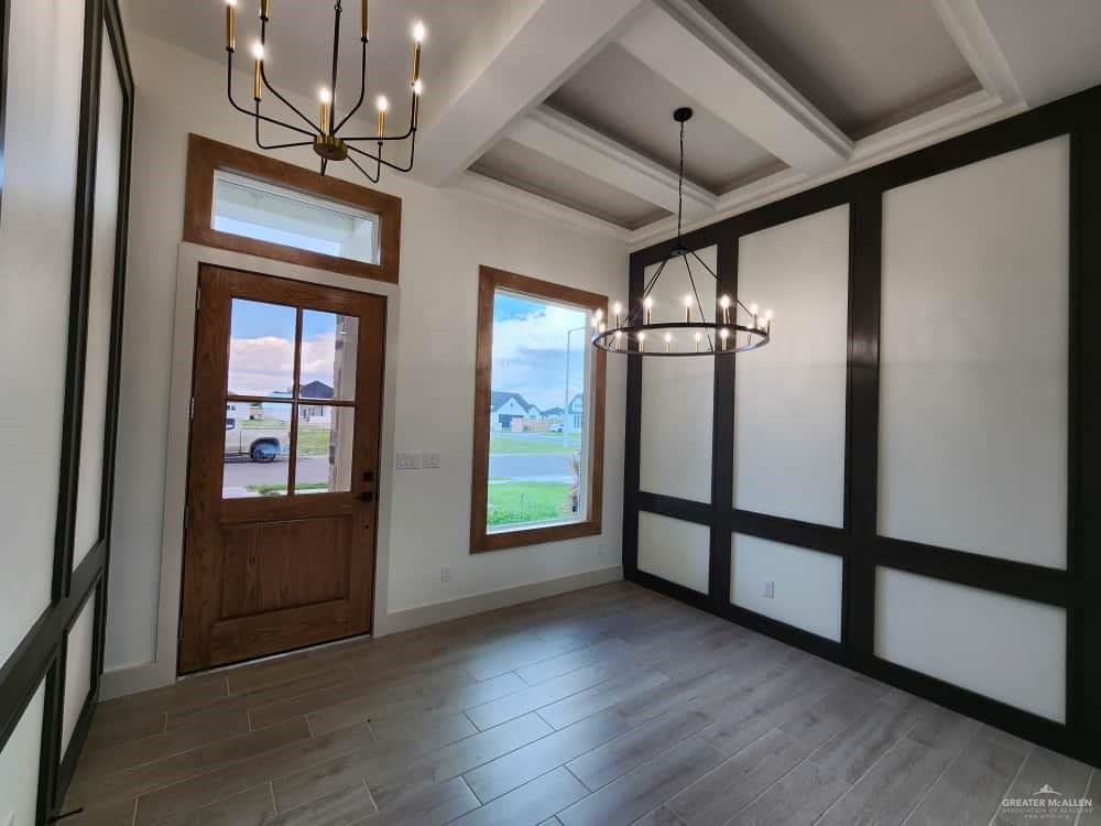 1003 Azalea Street Mission, TX 78573 - Photo 4 of 17 wooden floor in an empty room with a window