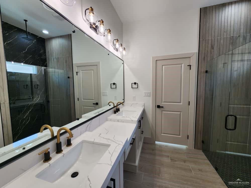 1003 Azalea Street Mission, TX 78573 - Photo 10 of 17 a bathroom with a sink and mirror