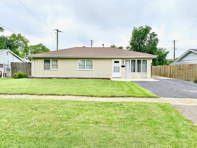 203 MacGregor Road Lockport, IL 60441 - Photo 1 of 12 a view of a house with a yard and potted plants