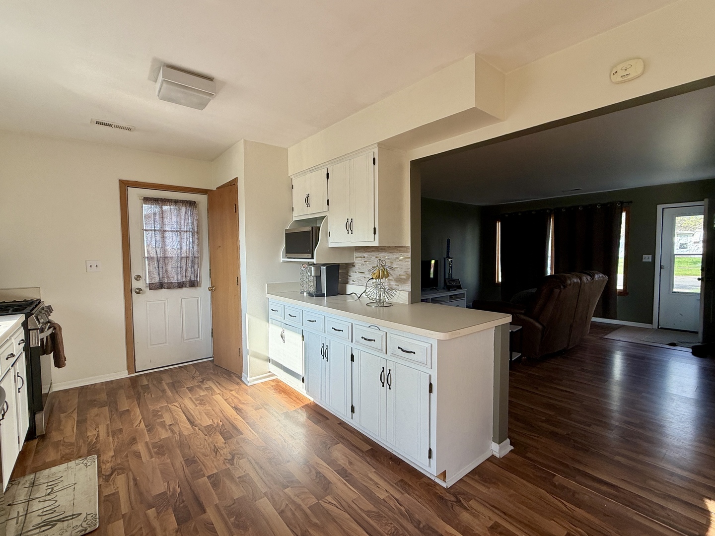 203 MacGregor Road Lockport, IL 60441 - Photo 2 of 12 a large kitchen with cabinets wooden floor and a sink