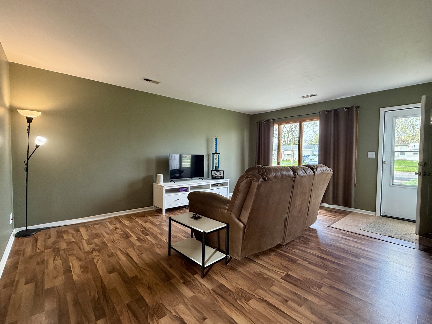 203 MacGregor Road Lockport, IL 60441 - Photo 5 of 12 a living room with furniture and a flat screen tv