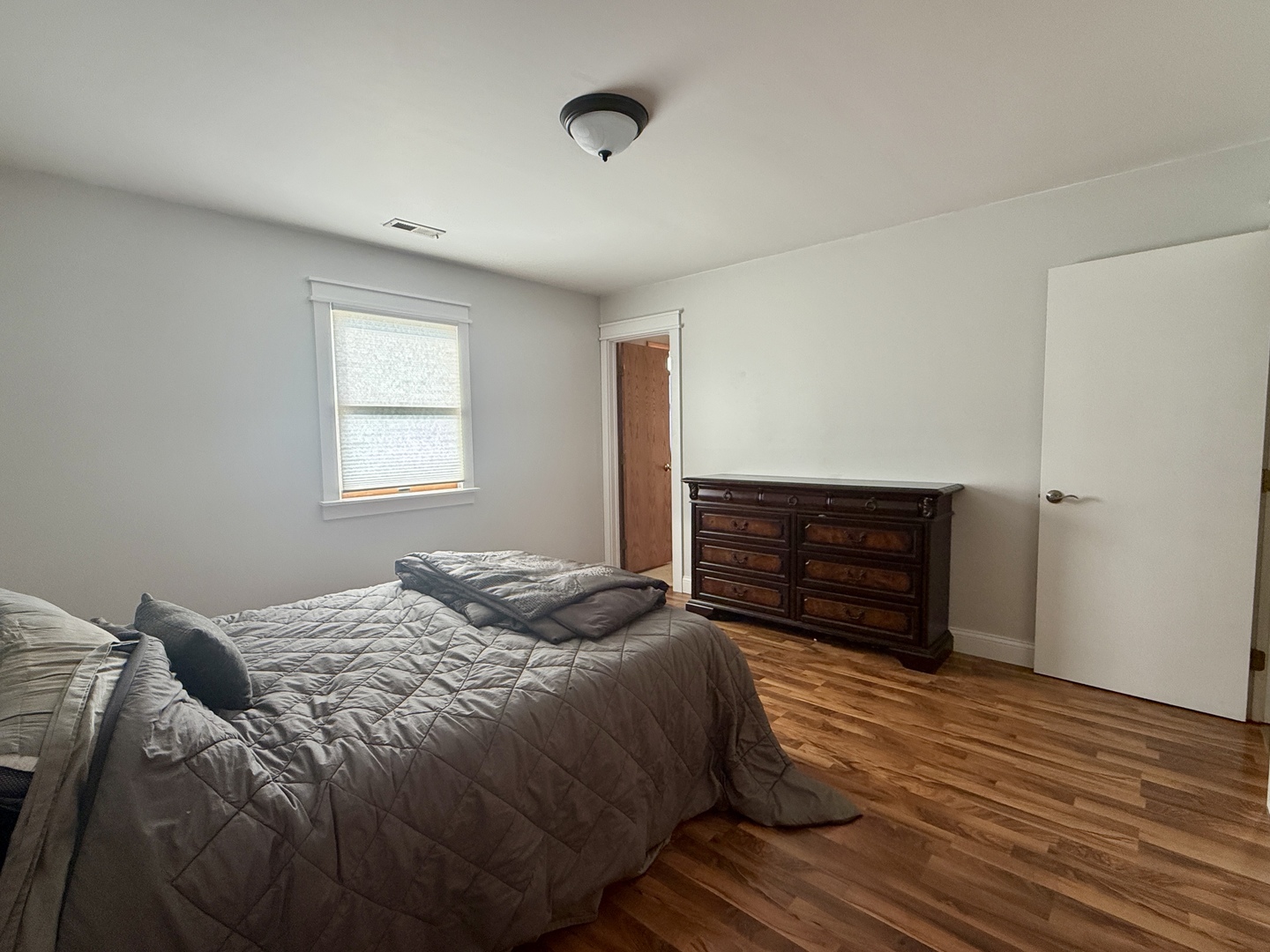 203 MacGregor Road Lockport, IL 60441 - Photo 8 of 12 a bedroom with a bed and wooden floor