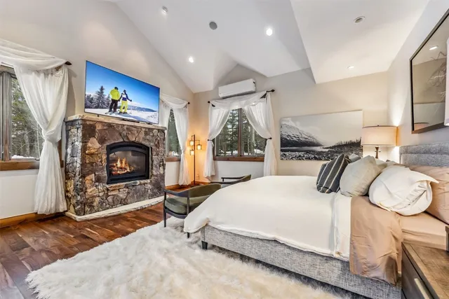 a spacious bathroom with a granite countertop sink and a mirror