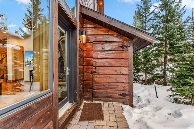a bathroom with a toilet and a shower curtain