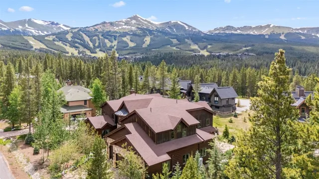 a view of a house with yard and sitting area