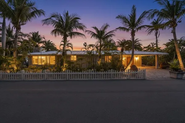 a view of outdoor space with palm trees