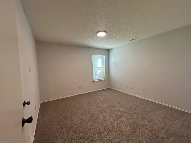a bathroom with a double vanity sink toilet and a mirror