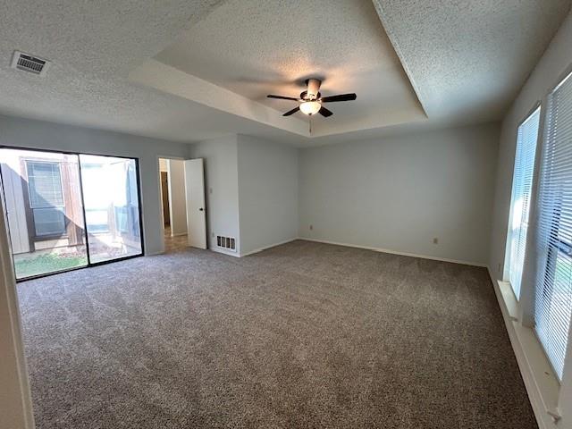 3910 St Christopher Lane Dallas, TX 75287 - Photo 16 of 20 an empty room with chandelier fan and windows