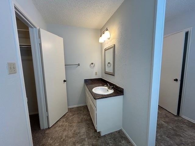 3910 St Christopher Lane Dallas, TX 75287 - Photo 19 of 20 a bathroom with a sink and a mirror