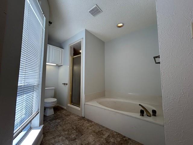 3910 St Christopher Lane Dallas, TX 75287 - Photo 20 of 20 a bathroom with a granite countertop toilet and a bathtub