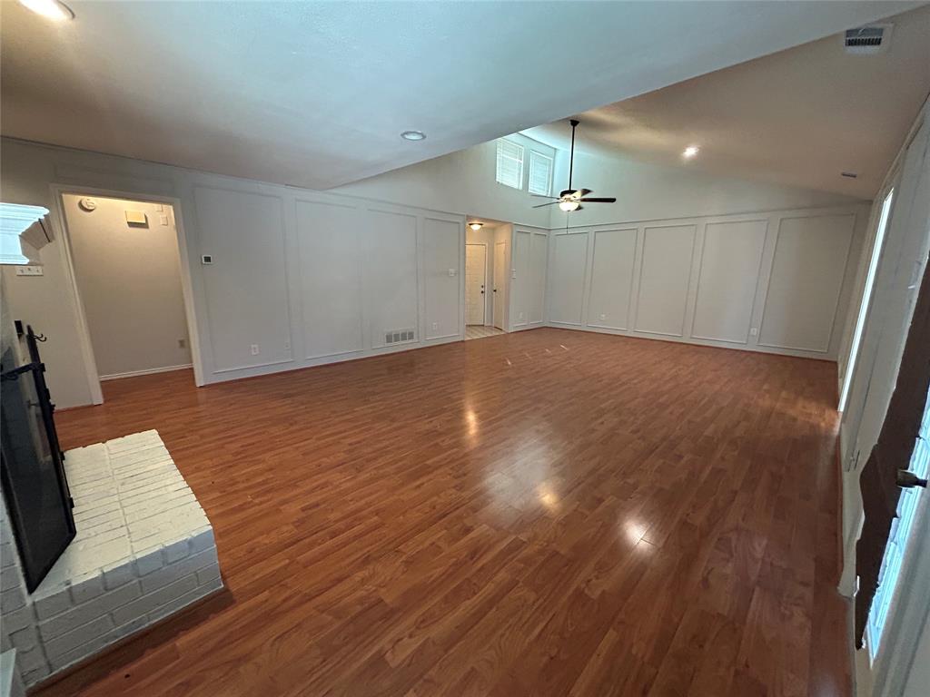 3910 St Christopher Lane Dallas, TX 75287 - Photo 10 of 20 wooden floor in an empty room with a window