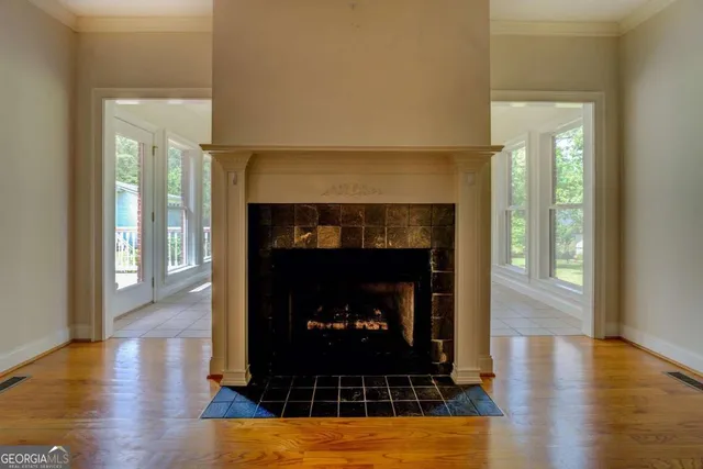a living room with furniture and a fireplace
